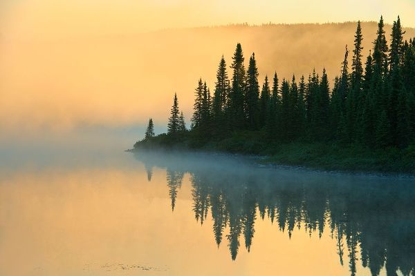 Canada-Quebec-Chibougamau Lake in fog at sunrise